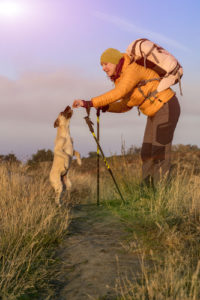 A brave woman and her dog learning new things on an adventure they undertake together.