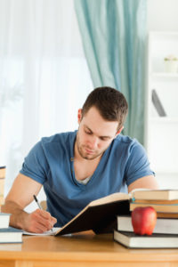 How to manage anger begins with learning about yourself and owning your own feelings, like this man studying.