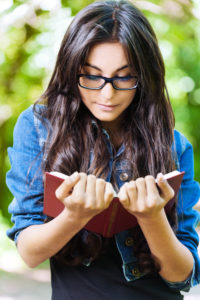 Improving our relationship patterns requires effort, such as studying like this woman.