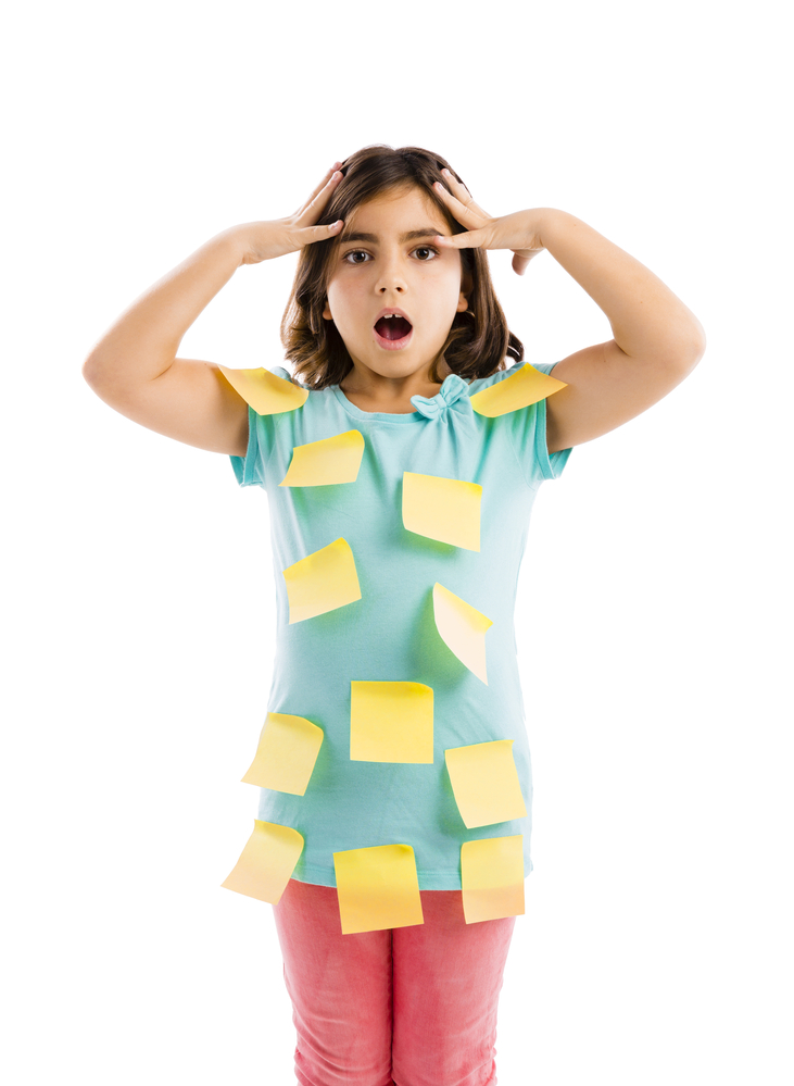 Labeling people can reinforce our views of them, like this girl overwhelmed with all of the labels attached to her.