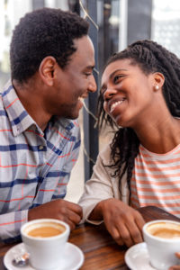 Communicating, instead of withdrawing, is the key to an ongoing, happy relationship like that of the happily smiling couple pictured.