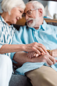 Communicating gently and without blame or judgement can help couples reconnect and last for a long time, like the happy, senior couple pictured.