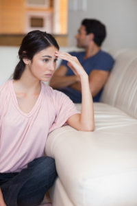 Being stuck in a standoff with a partner, like the couple pictured, can make bouncing back to the happiness of our relationship harder.