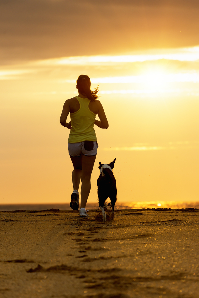 When we're upset, we process our feelings in different ways. Some people disengage and go for a run with their dog, like the woman pictured.