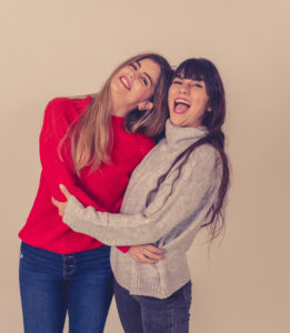 A pair of women opening up to one another.