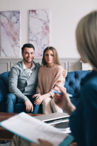 Couples counseling can help you with insecurity in relationships, like it's helping the couple pictured.